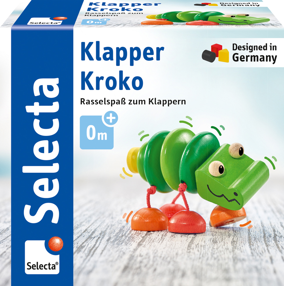 Boîte de « Klapper Kroko », un hochet en bois vert en forme de crocodile à faire claquer, de la marque Selecta, pour les enfants à partir de 0 mois.