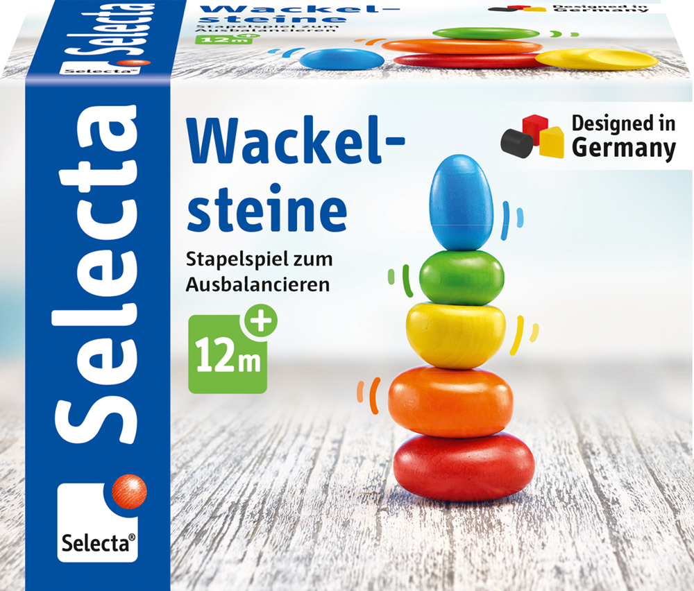 61028_Rolina_FS08_09_2019 Des pièces en bois colorées et arrondies empilées sur une boîte portant l'inscription « Wackelsteine », un jeu d'empilement en équilibre destiné aux tout-petits.